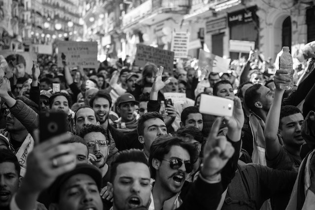 https://www.pexels.com/photo/crowd-of-people-black-and-white-photo-2246258/