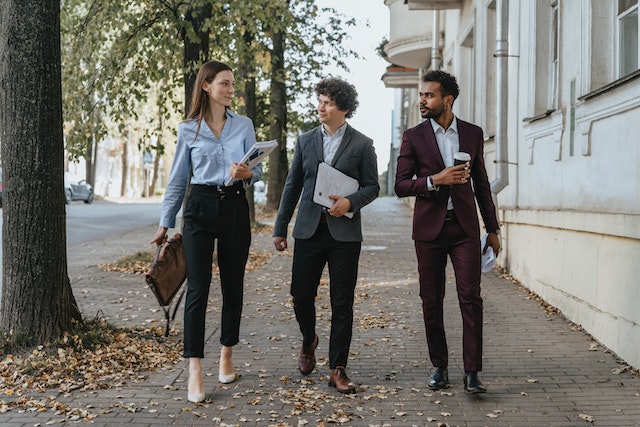 https://www.pexels.com/photo/people-walking-on-the-sidewalk-while-talking-5313179/